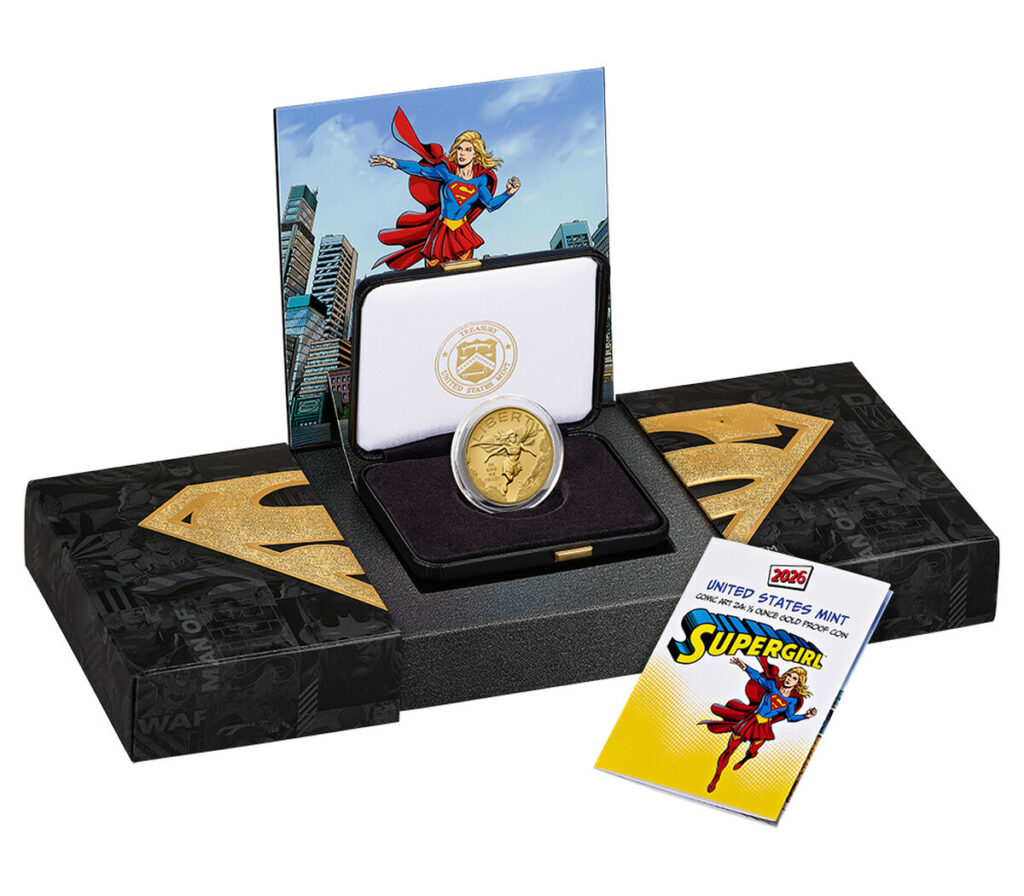 Supergirl 24-karat gold proof coin in its black display box with a pop up Supergirl comic panel and booklet