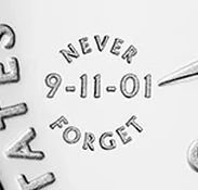 Close-up of the 9-11-01 privy mark encircled by NEVER FORGET on the half dollar obverse