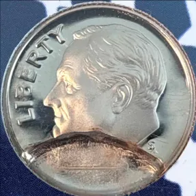 Close detail of the 2004-S proof Roosevelt dime obverse showing a smooth curved planchet indent across the lower quarter of the portrait